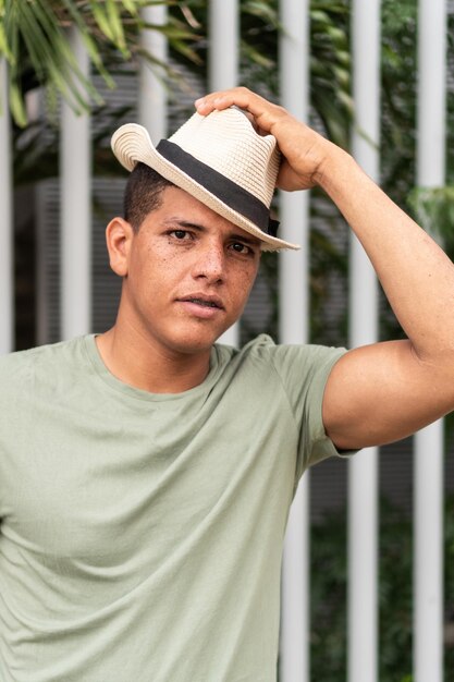 Portrait of a Latino man wearing a sombrero in the street