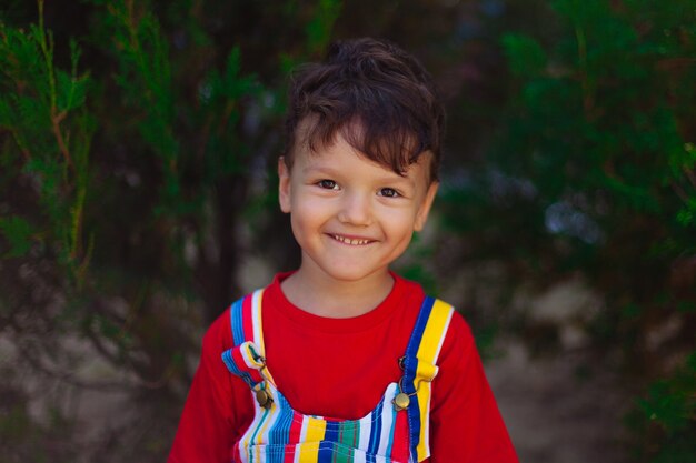 Portrait of a laughing child against the background of nature