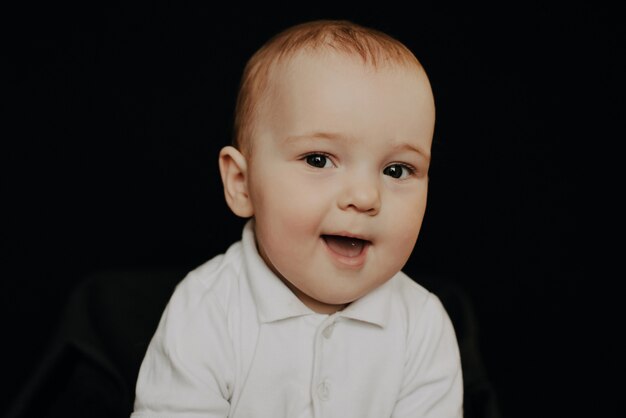 Portrait of a laughing little boy, Caucasian child kid