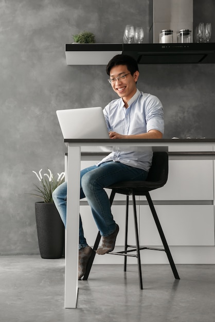 Portrait of a laughing young asian man