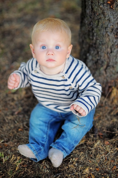 Portrait of little baby boy at the spring park