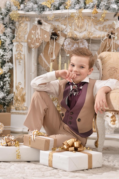 Portrait of little boy  near Christmas tree