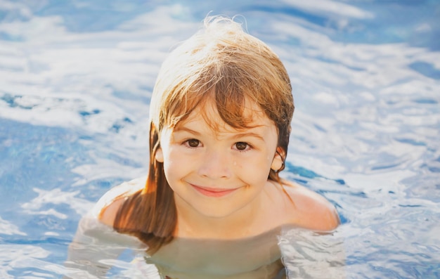 Portrait of little boy swim in sea Kid laughing in water of waves at sea Funny kids face