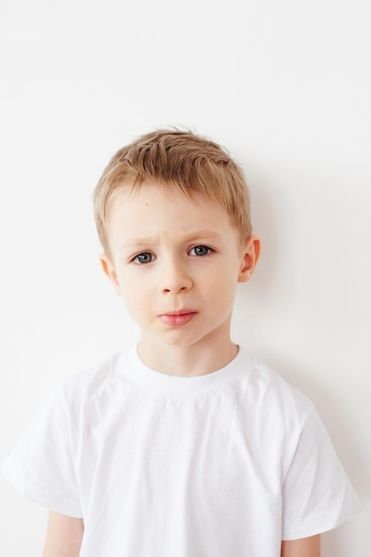 Portrait of little boy on white background