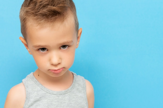 Portrait of little boy with expression on his face with sad and upset