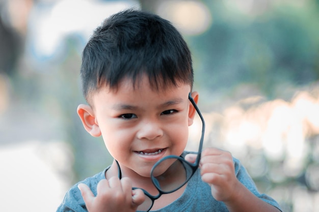 Portrait of little boy with glasses.