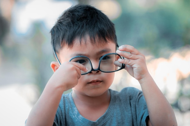 Portrait of little boy with glasses.