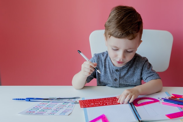 Portrait of a little boy with notebook