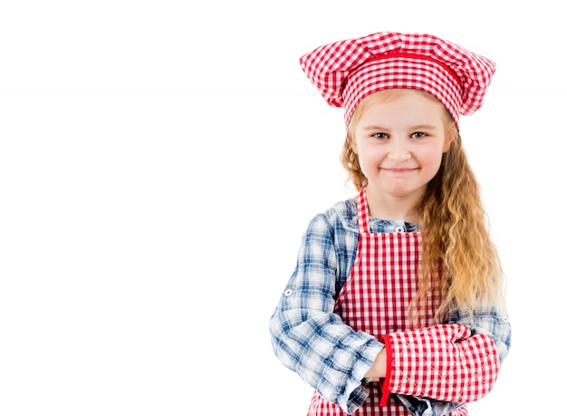 Portrait of a little chef girl isolated on a white backgroung