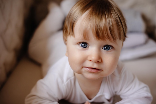 portrait of a little child, portrait of a baby with blue eyes .