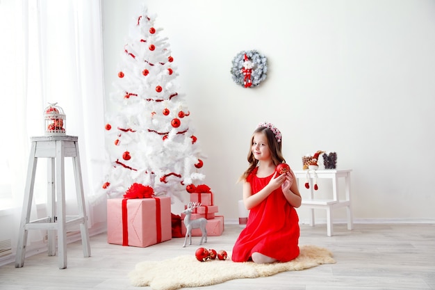 Portrait of little cute girl with Christmas decoration