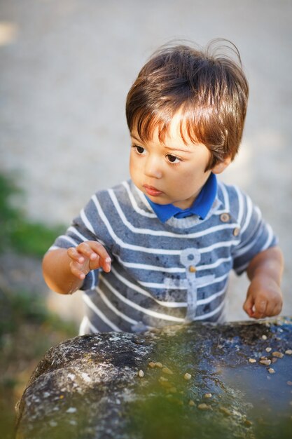 Photo portrait of a little eastern handsome baby boy playing outdoor in the park