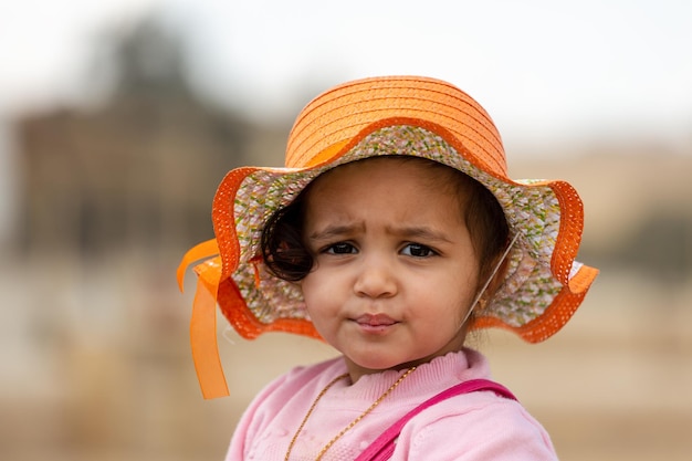 Portrait of a little Egyptian girl in a hat Cairo Egypt