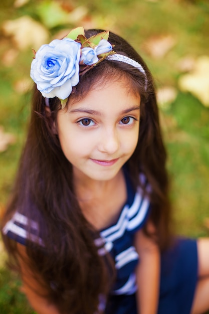 Portrait of little girl in autumn park 