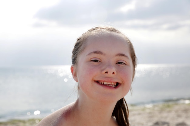 Portrait of a little girl in the background of the sea