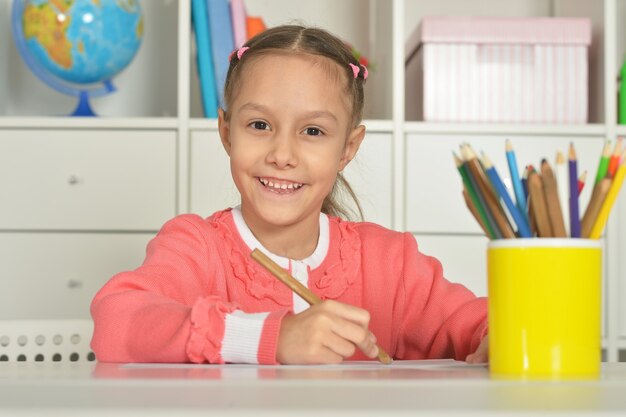 Portrait of Little girl drawing at home