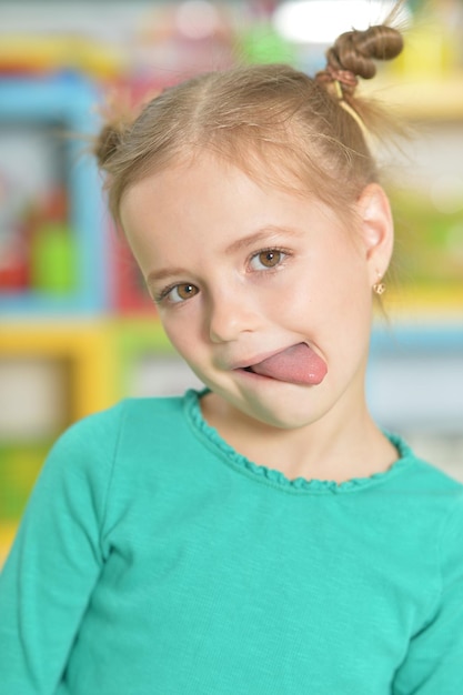 Portrait of a little girl making funny faces