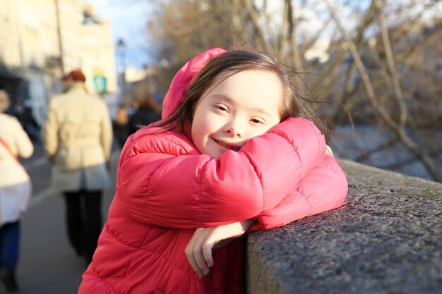 Portrait of little girl smiling in the city