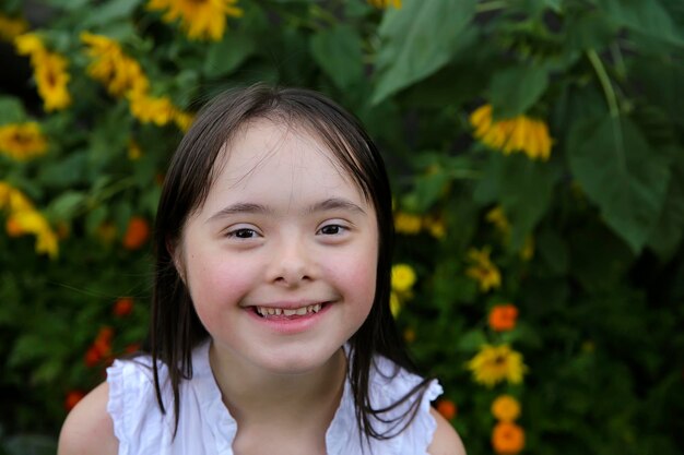 Portrait of little girl smiling in the garden