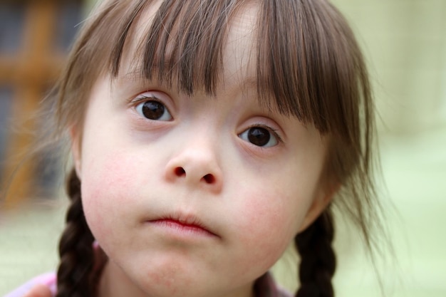 Portrait of little girl smiling outside