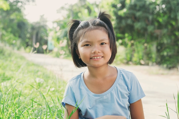 Portrait little girl smiling in park