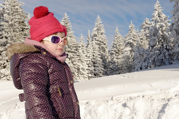 Portrait of a little girl in the snow