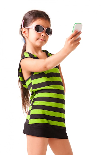 Portrait of a little girl in sunglasses and striped clothes