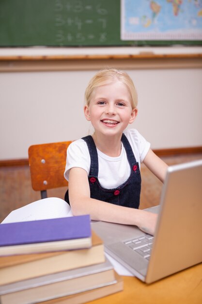 Portrait of a little girl using a notebook