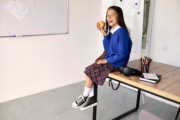 A portrait of a little schoolgirl in the classroom