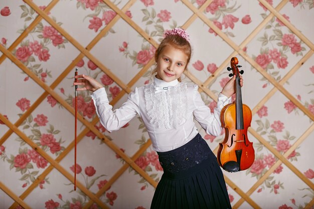 Portrait of the little violinist playing on violin