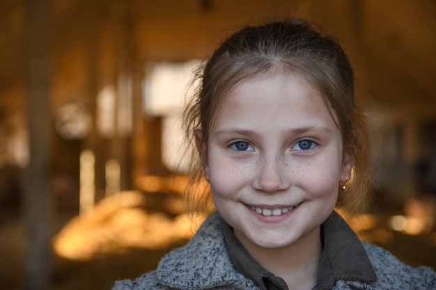 Portrait of a little, young cute smiling girl, close-up.Outdoor