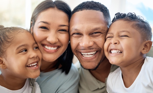 Portrait of love black family and happy smile on faces of American group on holiday Mom dad and children hug while bonding on vacation together Mother father and cute young kids enjoy childhood