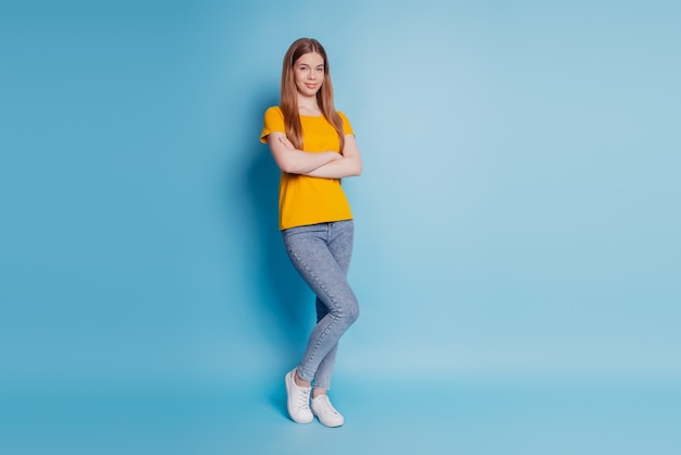 Portrait of lovely cool lady crossed arms wear casual clothes on blue background