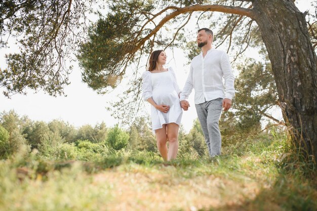 Portrait of lovely future parents during sunset