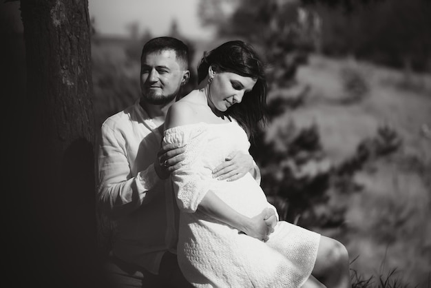 Portrait of lovely future parents during sunset