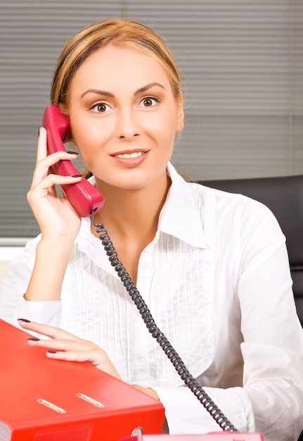 portrait of lovely girl with phone in office