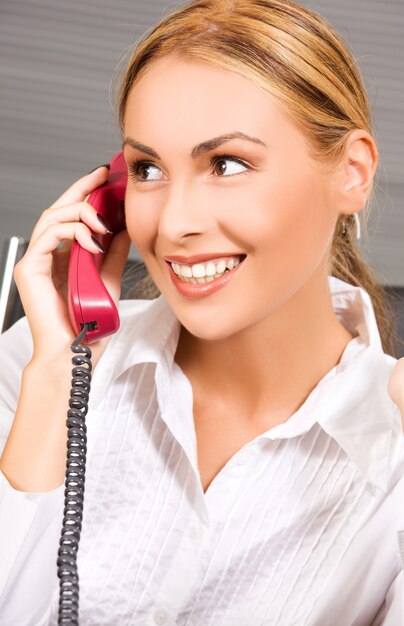 portrait of lovely girl with phone in office