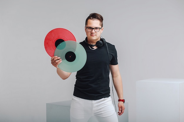 Photo portrait of a lover  music with vinyl records in hands