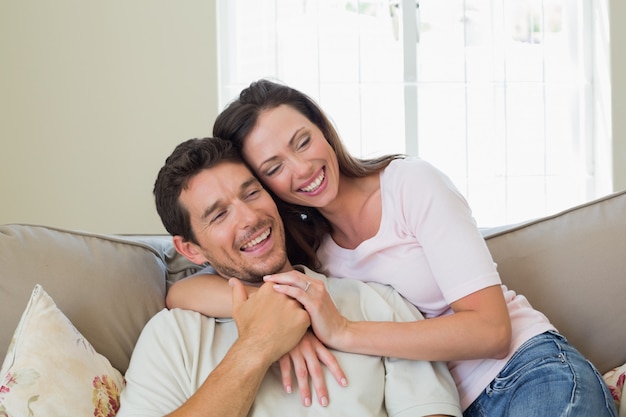 Portrait of a loving couple sitting on couch