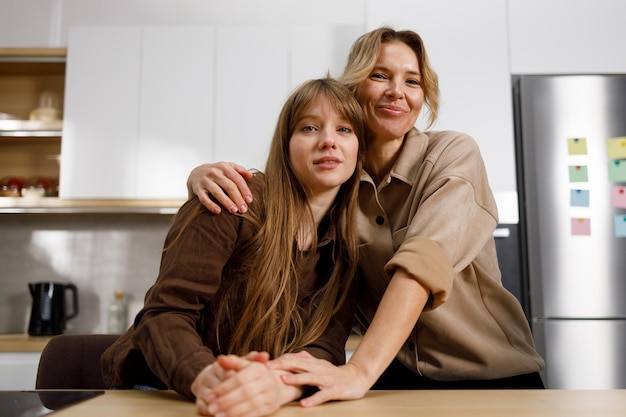 Portrait of a loving mother and her daughter in the kitchen