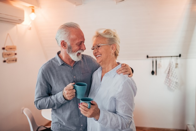 Portrait of a loving senior couple at home.