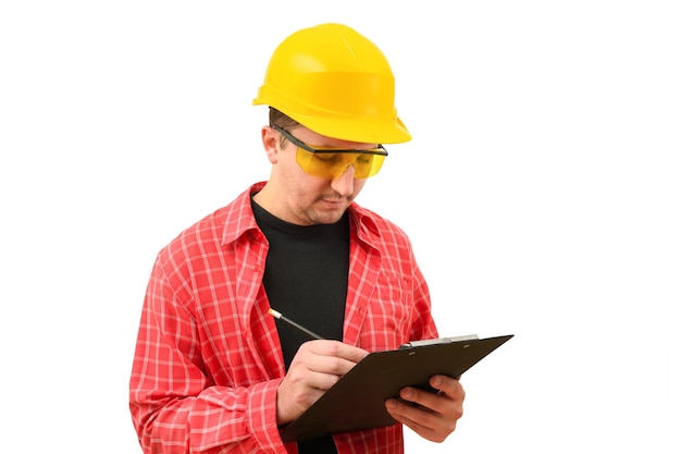 Portrait of a male builder in a helmet signing a contract on a white background Construction