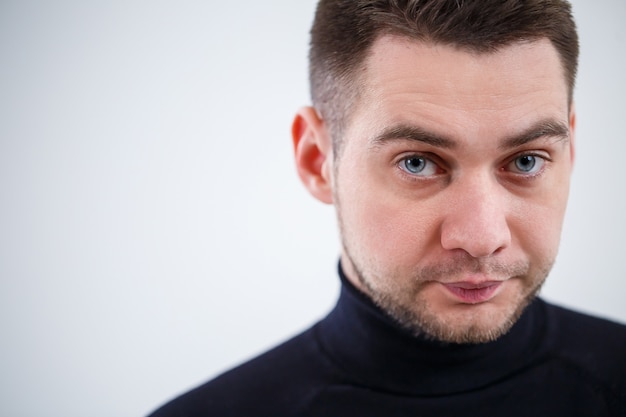 Portrait of a male businessman on a white background.