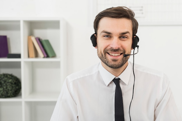 Portrait of male call center agent