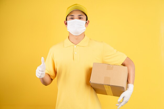 Portrait of male deliveryman wearing mask during epidemic season