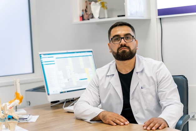 Portrait of male doctor in his office