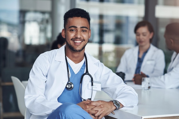 Portrait male doctor and hospital for healthcare physician and medical health staff Professional expert and surgeon with stethoscope man person or cardiologist for case research with colleagues