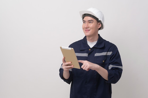 Portrait of male engineer wearing a protective helmet over white background studio