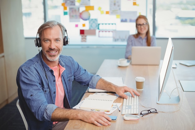 Portrait of male graphic designer with headphones