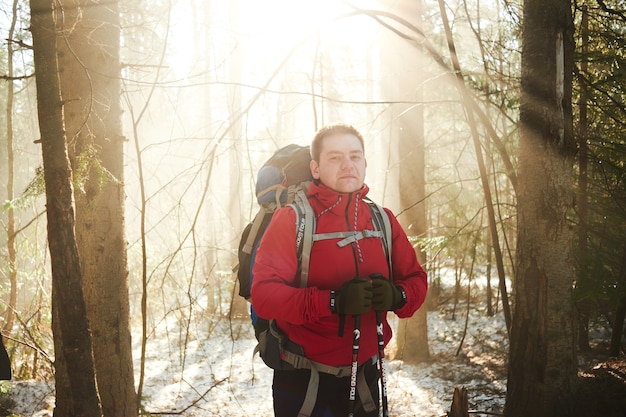 Portrait of male hiker in a spring forest